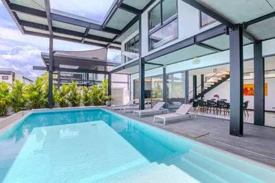 an indoor swimming pool in a house at Loft-Style Hyper Modern 4Br Villa Sunset garden 6 with 12x5m Salt Pool in Rawai Beach