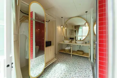 a bathroom with two sinks and a mirror at The Pin Boutique Pool Villa Krabi in Ao Nang Beach