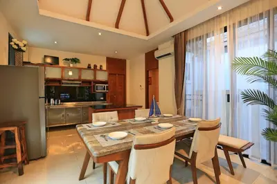 a kitchen and dining room with a table and chairs at 3bedroom pool villa only 250m to the Rawai beach F10 in Phuket Town