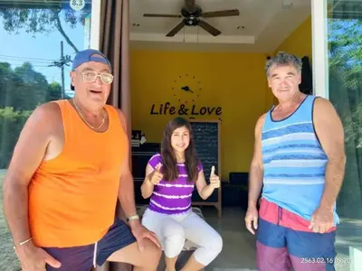 two men and a little girl posing for a picture at Life&Love Resort in Ban Khlong Son