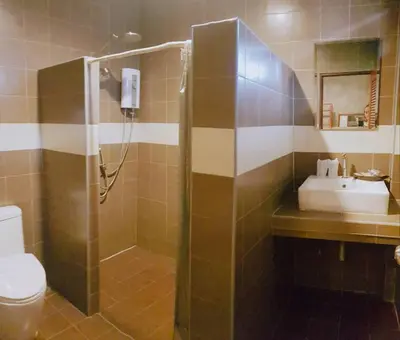 a bathroom with a shower and a sink at The Chic Pool Villa in Nai Yang Beach