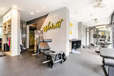 a gym with treadmills and dumbbells at CityGate by Villacarte in Kamala Beach