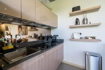 a kitchen with a sink and a counter at Sunpao Pool Villa by HCR in Layan Beach