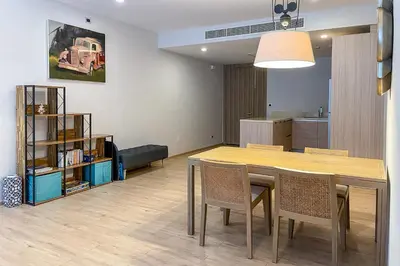 a dining room with a table and chairs at Baan Mai Khao - 2 Bedroom Luxury Condo - Direct Pool & Beach Access in Mai Khao Beach