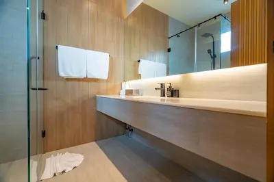 a bathroom with a sink and a mirror at Modern 4BR Villa with Private Pool in Bangtao in Bang Tao Beach