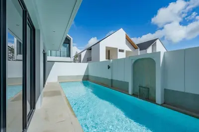 a swimming pool in the backyard of a house at Modern 4BR Villa with Private Pool in Bangtao in Bang Tao Beach