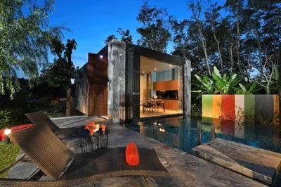 a house with a swimming pool in the backyard at Seclusion in the mountains, villa near Kamala beach in Kamala Beach