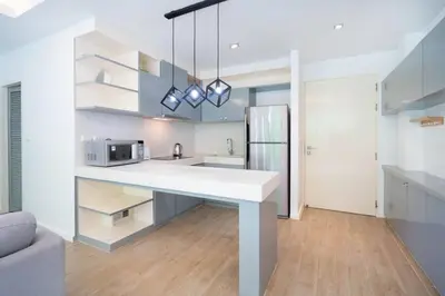 a kitchen with a white counter top in a room at The tree seaview and quiet surrounded by trees 75smetre in Kamala Beach