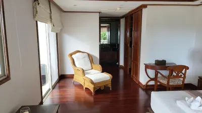 a living room with a chair and a table at Villa Mauao - Luxury Villa in Katamanda, Kata in Kata Beach