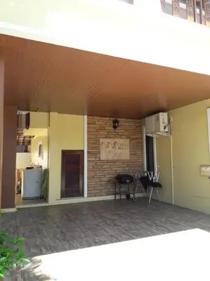 a living room with a fireplace in a house at 4BD Private pool villa in Patong heart quiet&nice in Patong Beach