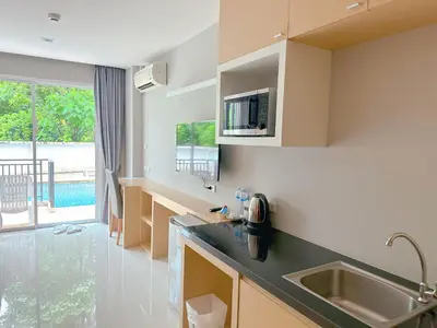 a kitchen with a sink and a counter top at Ahad Suite Aonang in Ao Nang Beach