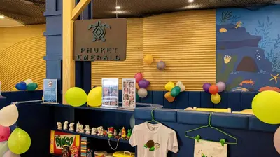 a store with a bunch of balloons on the wall at Phuket Emerald Beach Resort in Karon Beach