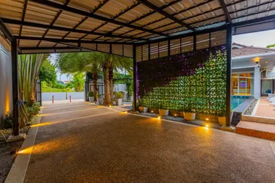 a building with a large wall of wine bottles at 3 Bedroom Platinum Pool Villa Smooth as Silk in Ban Khlong Haeng