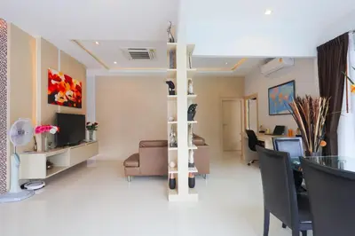 a living room with a couch and a table at 3 Bedroom Platinum Pool Villa Smooth as Silk in Ban Khlong Haeng