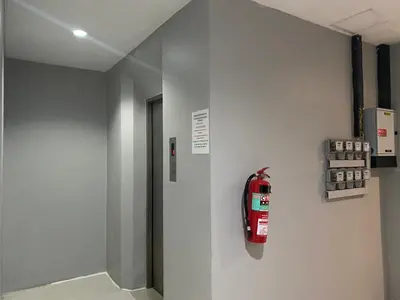 a room with a fire hydrant on a wall at Lavender Patong Hotel in Patong Beach