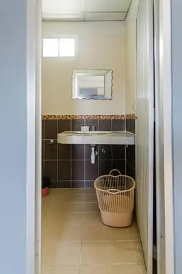 a bathroom with a sink and a mirror at Pailin Hill Hotel Patong in Patong Beach