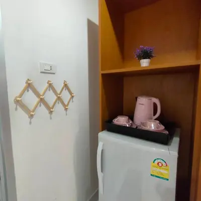 a refrigerator with a tea pot on top of it at Pailin Hill Hotel Patong in Patong Beach