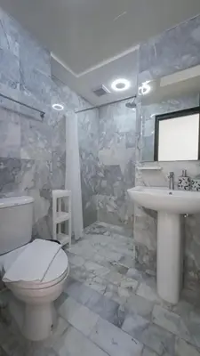 a bathroom with a toilet and a sink at Квартира in Mai Khao Beach