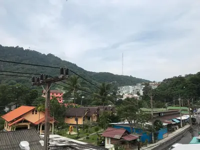 a view of a town with houses and a mountain at Apartment kata in Kata Beach
