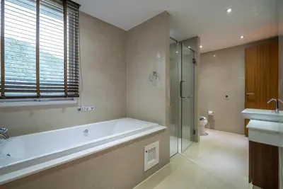 a bathroom with a tub and a shower and a sink at Sea view apartment at The Privilege by Lofty in Patong Beach