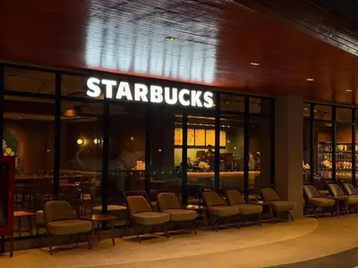 a restaurant with chairs and a sign that reads starbucks at Title V Mountain View Pool View Gym Hammam in Rawai Beach