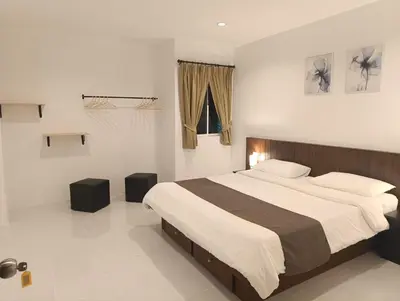 a bedroom with a large bed and a basketball hoop at Phuket Jungle Experience Resort in Karon Beach