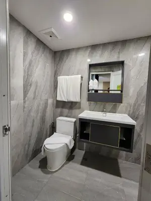 a bathroom with a toilet and a sink at iCheck inn Darisa Patong in Patong Beach