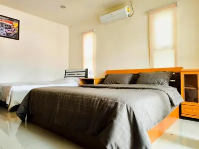 a bedroom with two beds in a room at Nu Phuket Airport Resident 1 in Nai Yang Beach