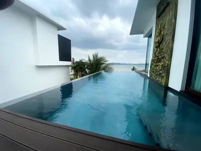 a swimming pool on the side of a building at Sunrise Villa 21 in Phuket Town
