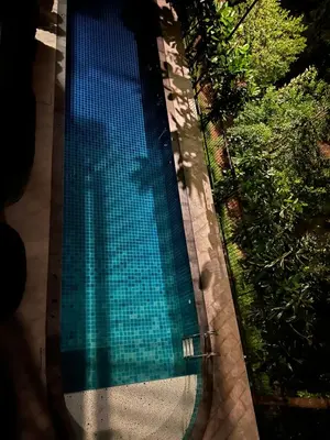 an overhead view of a swimming pool at Seaside vacation in Rawai Beach