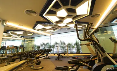 a gym with a bunch of treadmills and a lot at The Beach Heights Condotel Kata 500 meters to Kata beach in Kata Beach
