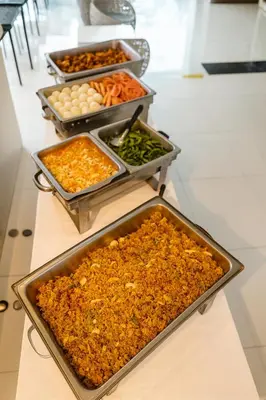 a buffet with many trays of food on a table at Patong Platinum in Patong Beach
