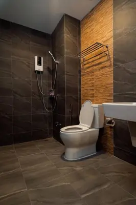 a bathroom with a toilet and a sink and a shower at Terminal 58 Airport in Ban Mut Dok Khao
