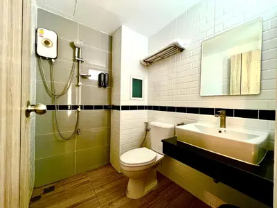 a bathroom with a sink and a toilet and a shower at THE NICE in Patong Beach