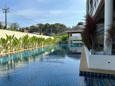 a swimming pool in front of a building at Bel Air Cape Panwa resort apartment in south Phuket with pool access ,near Ao Yon in Phuket Town