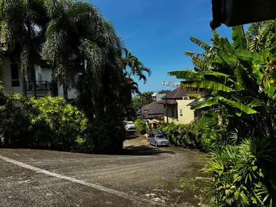 a car parked in a driveway next to a house at Seaview Prima Villa Karon beach in Karon Beach