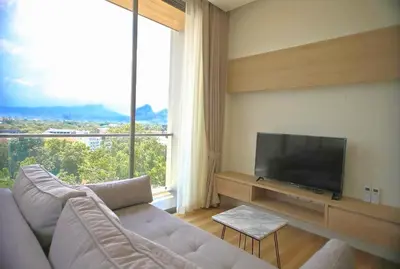 a living room with a couch and a flat screen tv at CORNER SEA VIEW KRABI Ao Nang 4 STARS HOTEL RESIDENCE in Ao Nang Beach