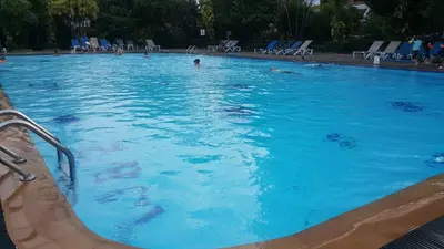 a large swimming pool with people in the water at PATONG TOWER EXCLUSIVE FAMILYs SEA VIEW 2025 in Patong Beach
