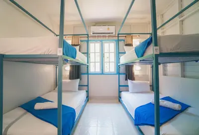 a room with three bunk beds in it at Bodega Koh Phi Phi in Phi Phi Don