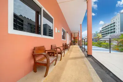 a row of chairs sitting on the side of a building at Jungceylon Villa - quiet location, pool, maid in Patong Beach