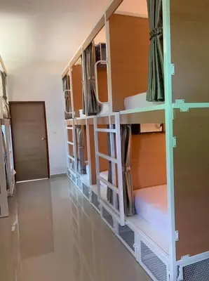 a room with three bunk beds in a room at Phuketnumnoi23 in Surin Beach