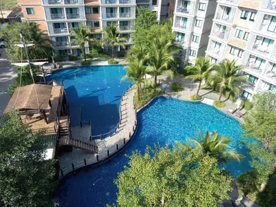 an overhead view of a swimming pool with palm trees and buildings at А2 ВАТСАП669З582I976 примем РУБЛИ in Nai Yang Beach