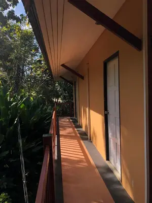 a walkway leading to a door of a house at Relaxation guesthouse in Thalang