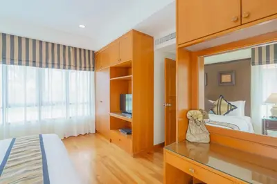 a bedroom with a bed and a large mirror at 3-4BR Laguna Phuket Golf Course Villa with Pool & Jacuzzi in Laguna Phuket
