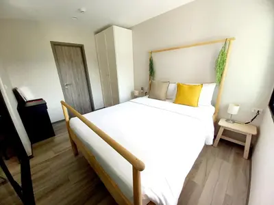 a bedroom with a large bed with yellow pillows at С8 С9 ВАТСАП669З582I976 принимаем РУБЛИ in Nai Yang Beach