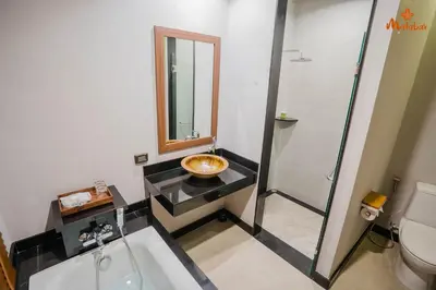 a bathroom with a sink and a toilet at Malabar Pool Villa Phuket in Phuket Town
