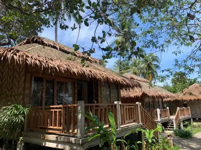 a small hut with a thatched roof and a porch at Better View Koh Yao Yai in Ko Yao Yai