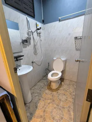 a bathroom with a toilet and a sink at PhuketAirportCamping in Mai Khao Beach