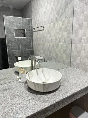 a bathroom with a sink and a mirror at Kata Noi Place in Kata Beach