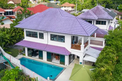 an aerial view of a house with purple roof at Villa Amaya, 2 Story Tropical Oasis with Green Hills View & Pool, Kamala Beach in Kamala Beach